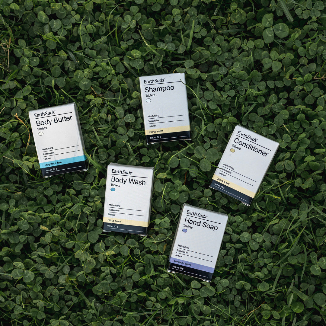 EarthSuds travel packs including shampoo, conditioner, body wash, hand soap, and body butter.