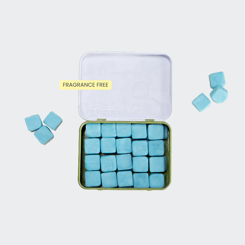 Travel body wash with blue tablets in a reusable case that's plastic-free and sustainable.