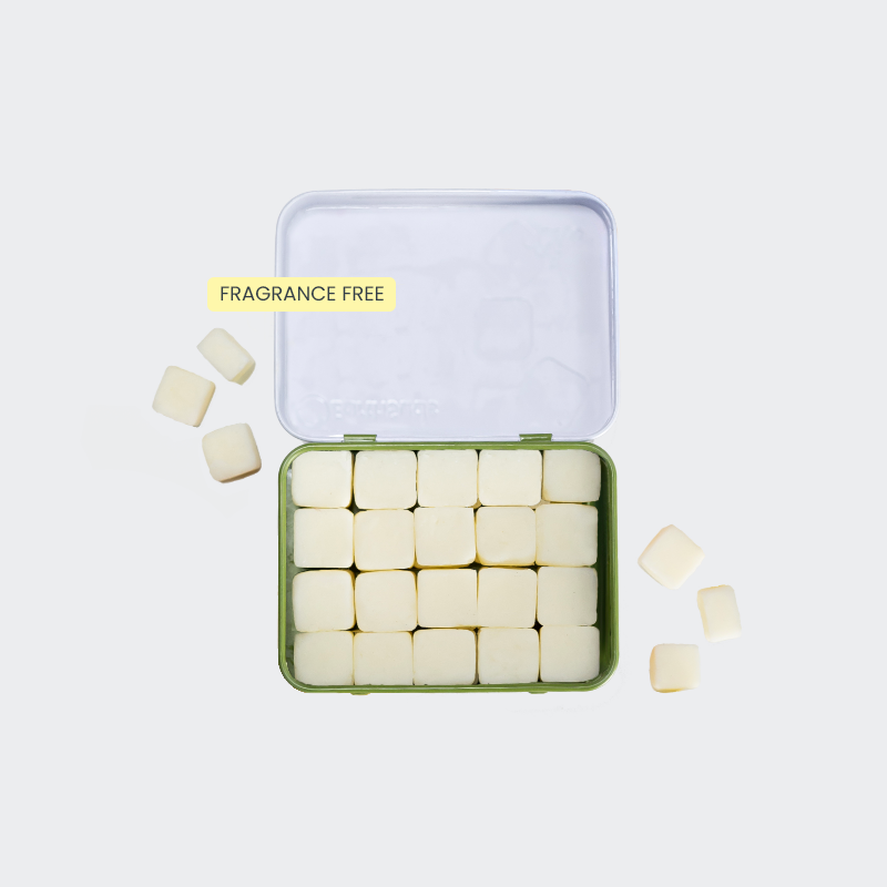 Travel shampoo with white tablets in a reusable case that's plastic-free and sustainable.
