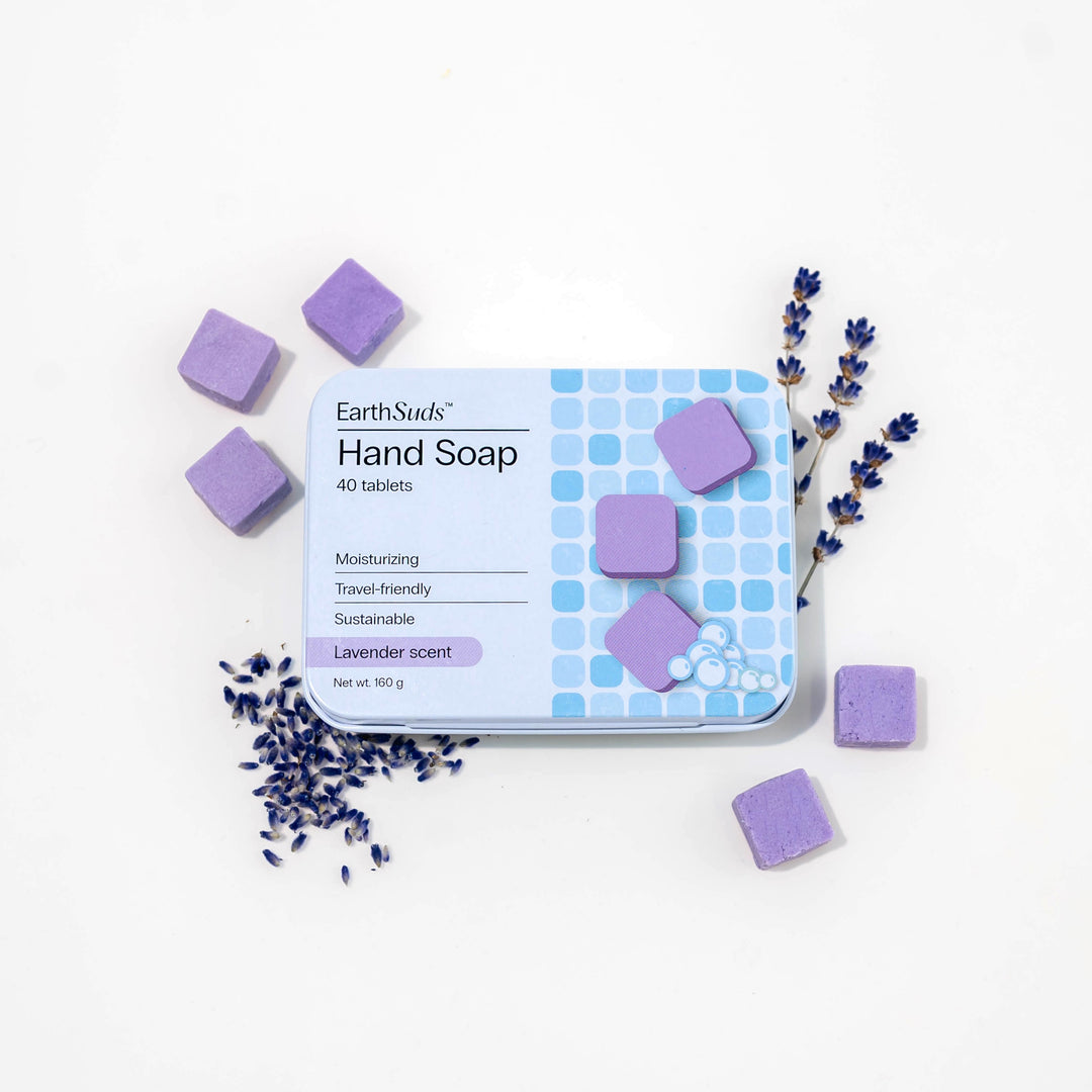 Travel hand soap pack with dissolvable, biodegradable hand soap tablets and lavender around it.