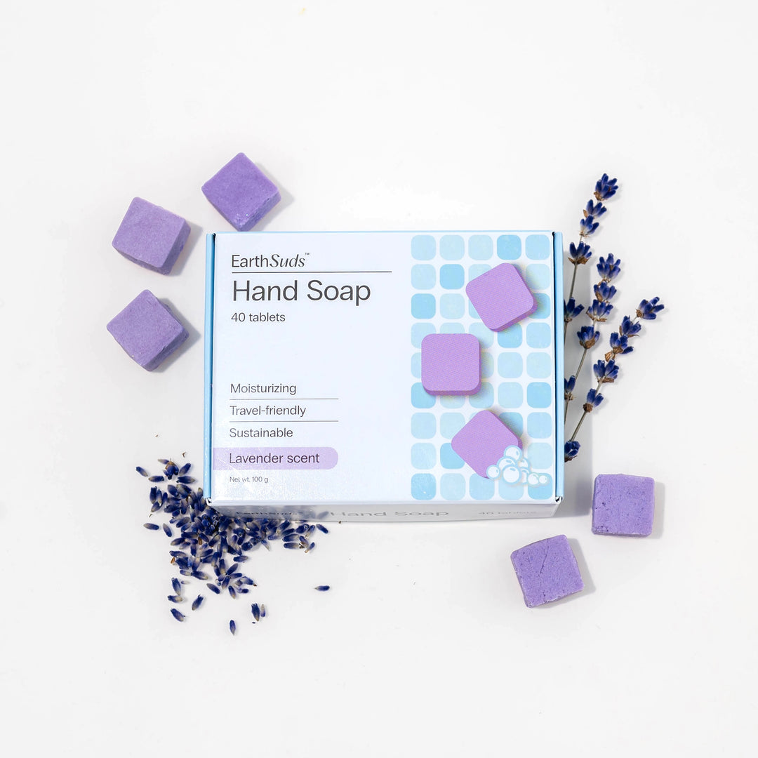 Travel hand soap pack with dissolvable, biodegradable hand soap tablets and lavender around it.