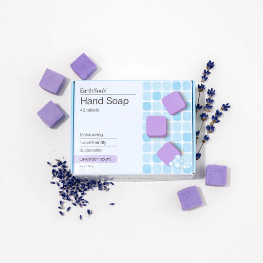 Travel hand soap pack with dissolvable, biodegradable hand soap tablets and lavender around it.