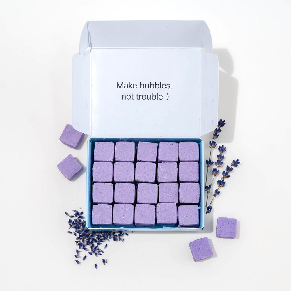 Travel hand soap pack with dissolvable, biodegradable hand soap tablets and lavender around it.