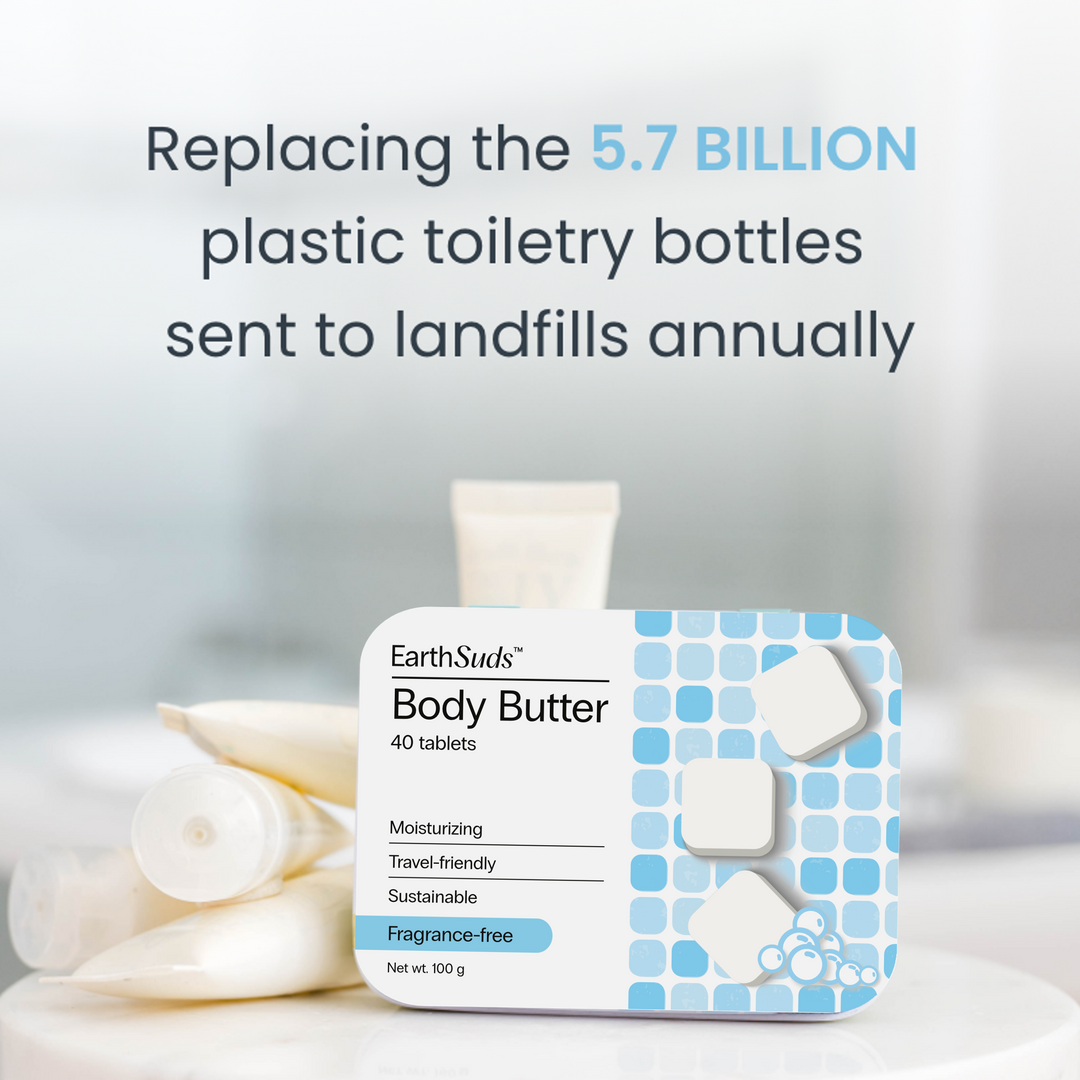Travel body butter tablets in a reusable case on a countertop beside plastic shampoo bottles.