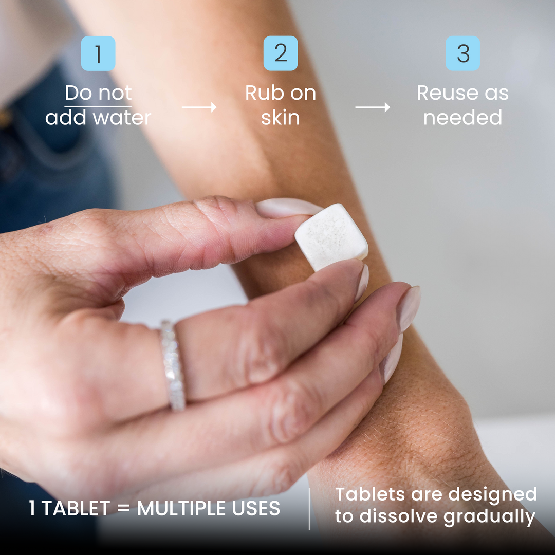 Person applying a body butter tablet to their arm with instructions on how to use it.