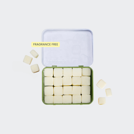 Travel shampoo with white tablets in a reusable case that's plastic-free and sustainable.