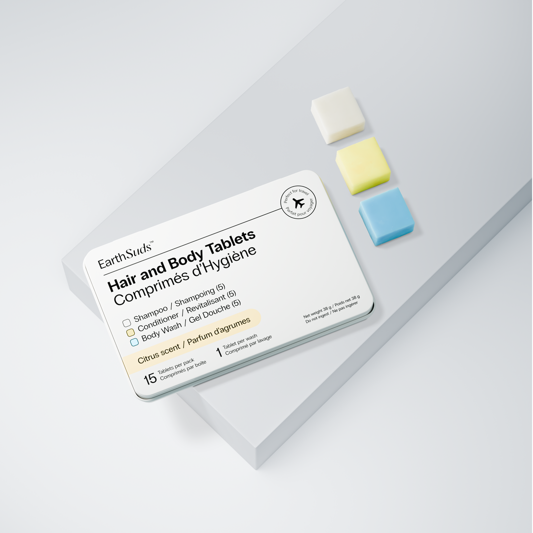 EarthSuds hair and body tablets that are travel-friendly, compact, sustainable, and biodegradable on a light gray background.