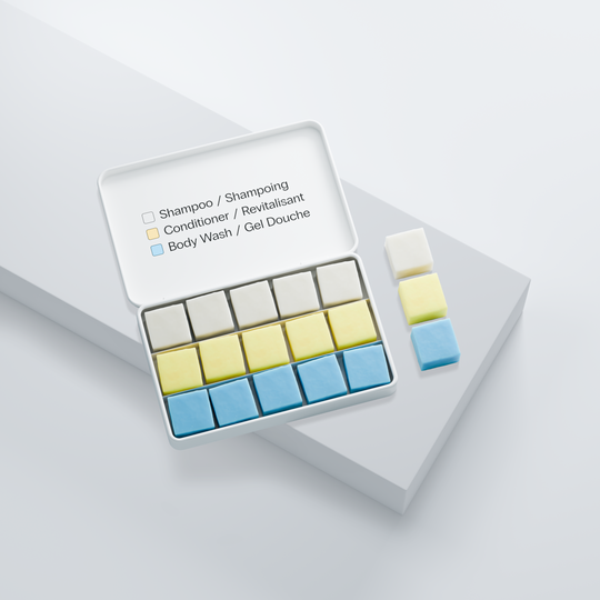 EarthSuds shampoo, conditioner, body wash tablets that are travel-friendly, compact, sustainable, and biodegradable on a light gray background.